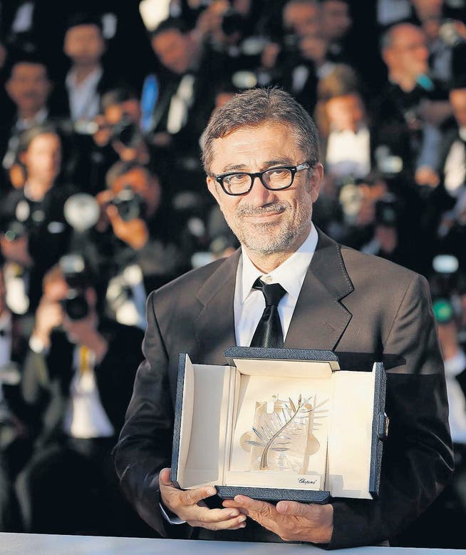 Der türkische Regisseur Nuri Bilge Ceylan erhielt die Goldene Palme für «Winter Sleep». (Bild: epa/Sebastien Nogier)