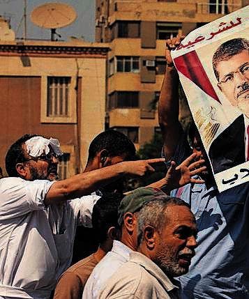 Mursi-Anhänger marschieren auf. (Bild: ap)