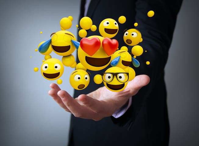 Die gelben Gesichter mit allerlei Gefühlsregungen sollen die Kommunikation im Büro effizienter und persönlicher machen. Bild: Getty
