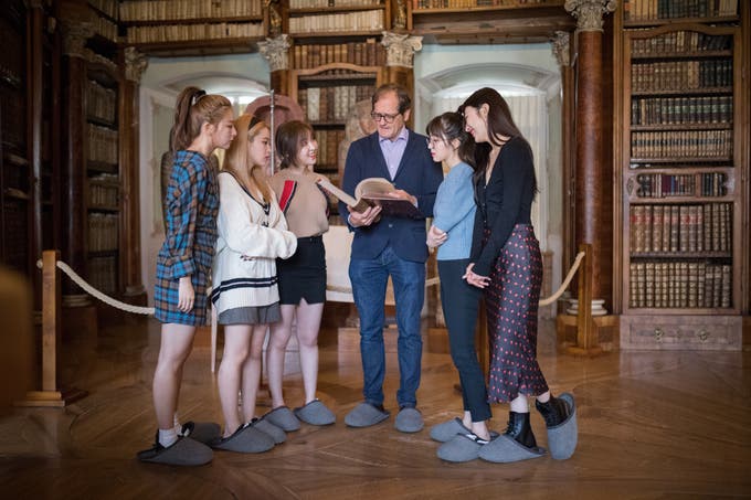 In order to protect the ancient wooden floor, everyone has to wear felt slippers. (Image: Benjamin Manser)