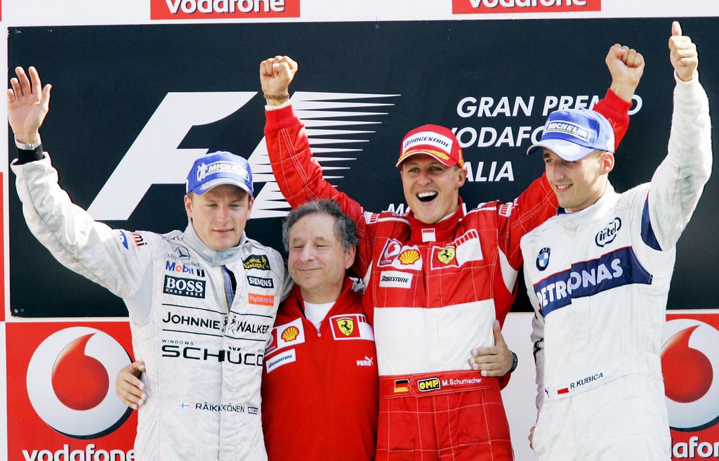 Kimi Räikkönen mit Michael Schuhmacher und Robert Kubica.