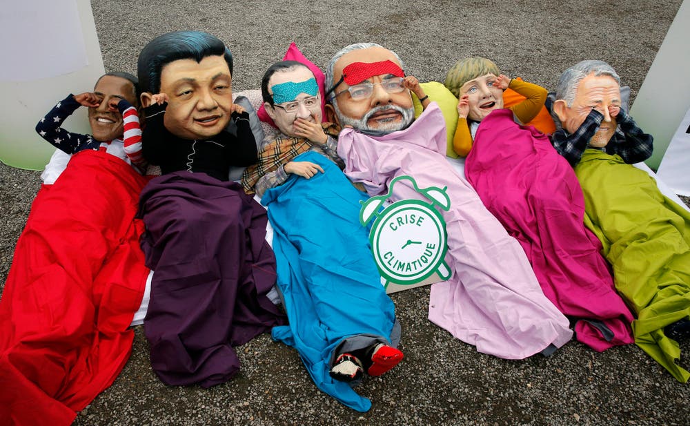 Aktivisten zeigen, was Barack Obama, Xi Jinping, Francois Hollande, Narendra Modi, Angela Merkel und Malcolm Turnbull amachen sollen: Aufwachen. (Bild: AP Photo/Christophe Ena)