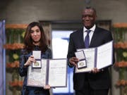 Die jesidische Aktivistin Nadia Murad und der kongolesische Gynäkologe Denis Mukwege am Montag in Oslo mit dem Friedensnobelpreis. (Bild: Keystone/AP NTB scanpix/HAAKON MOSVOLD LARSEN)
