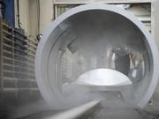Fracht-Container sollen dereinst durch den Tunnel aufs Schiff. (Bild: KEYSTONE/PATRICK HUERLIMANN)