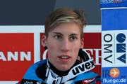 Thomas Diethart auf dem Siegerpodest beim Springen in Garmisch-Partenkirchen. (Bild: Keystone)