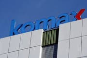 Das Firmenlogo der Firma Komax. (Bild: Keystone)