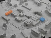 Die beiden Erweiterrungsbauten des Projekts «Strichpunkt»: Links der Strich (orange), rechts der Punkt (blau).