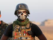Wer hat keine Angst vor mir? - Mitglied der irakischen Antiterror-Eliteeinheit, die am Sturm auf Mossul beteiligt ist. (Bild: KEYSTONE/AP/KHALID MOHAMMED)