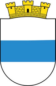 Das Original: Weiss, blau, weiss: einfach und prägnant. So ist das Stadtzuger Wappen, dem Anfang des 20. Jahrhunderts am oberen Rand eine gelbe Burgmauer hinzugefügt wurde. Dies deshalb, damit man es von dem an den Kanton entlehnten Wappen unterscheiden kann, das ein dunkleres Blau für den Balken besitzt.