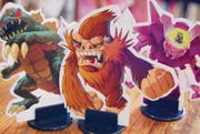 Sieht aus wie in einem japanischen B-Movie, ist aber ein Spiel: In «King of Tokyo» kämpft man mit Monstern gegen seine Mitspieler. (Bilder: pd)
