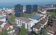 Das Stadtwald-Quartier mit neuen Hochhäusern, neuem Wohn-/Gewerbehaus (im Vordergrund) und umgebauter Alcan-Halle mit Glasdach. (Bild: Hardy Buob)
