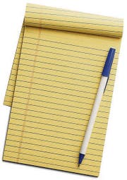 Yellow line notepad with pen on top isolated on a white background. (Bild: Beda Hanimann)