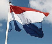 Dutch national flag on liberty day against blue sky with clouds (Bild: (79790892))