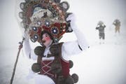 Silvesterchläuse unterwegs in Waldstatt. (Bild: GIAN EHRENZELLER (KEYSTONE))