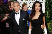 George Clooney mit Amal Clooney (Bild: Hubert Boesl (dpa))