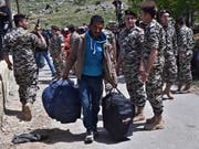 Ein syrischer Flüchtling im Libanon auf dem Rückweg in sein Heimatland. (Bild: KEYSTONE/AP/ZIAD CHOUFI)
