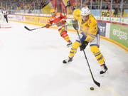 Simon Kindschi wird in der neuen Saison für die SCL Tigers verteidigen (Bild: KEYSTONE/ANTHONY ANEX)