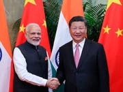 Indiens Regierungschef Narendra Modi (l) und Chinas Präsident Xi Jinping einigten sich auf eine friedliche Beilegung der Grenzstreitigkeiten zwischen den beiden Ländern. (Bild: KEYSTONE/AP Xinhua/JU PENG)