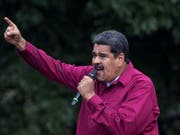 Nicolás Maduro preist sich auf einer Manifestation in Caracas mit neuen Versprechungen als Präsident Venezuelas an. (Bild: KEYSTONE/AP/ARIANA CUBILLOS)