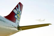 Fliegender Geografieunterricht: Schweizer Passagierflugzeuge tragen oft Namen von Städten, Kantonen und Bergen. (Bild: KEYSTONE/Walter Bieri)