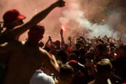 Supporter vor dem Champions League Final zwischen Real Madrid und Liverpool. Bild: AP Photo/Andrew Kravchenko