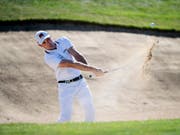 Joel Girrbach zeigt seine Künste im Sandbunker (Bild: KEYSTONE/OLIVIER MAIRE)