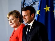 Angela Merkel und Emmanuel Macron am Dienstag nach ihrer Medienkonferenz in Meseberg. (Bild: Keystone/EPA/FILIP SINGER)