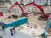 Die verstärkte Solidarhaftung wirkt präventiv gegen Lohndumping auf Schweizer Baustellen. Der Bundesrat will daran festhalten. (Bild: KEYSTONE/PATRICK HUERLIMANN)