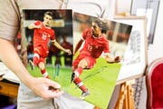 Signierte Fotos von Xhaka und Rodriguez.