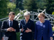 Wollen US-Präsident Donald Trump am G7-Gipfel in Kanada die Stirn bieten: Frankreichs Staatschef Emmanuel Macron, die britische Premierministerin Theresa May und die deutsche Kanzleirn Angela Merkel. (Bild: KEYSTONE/AP/DARKO VOJINOVIC)