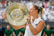   Posing with the Wimbledon Trophy: Angelique Kerber. Image: Neil Hall / EPA (July 14, 2018) 