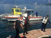 Rettungstaucher im Einsatz nach einem Bootsunglück im Genfersee bei St-Gingolph VS. (Bild: Kantonspolizei Wallis)