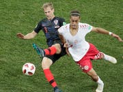 Kroatiens Ivan Strinic, hier an der WM gegen Dänemarks Poulsen, wechselt zur AC Milan (Bild: KEYSTONE/AP/DMITRI LOVETSKY)