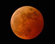   The glowing moon during a total lunar eclipse. 