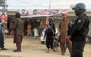   Police officers guard a PTI office in the Pakistani city of Quetta. (Photo: Ahmed Fayyaz / EPA, July 16, 2018) 