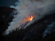 In Kalifornien wüten drei Waldbrände und zerstören zehntausende Hektar Wald - wie hier die Flammen des Ferguson Feuers in der nähe des Yosemite Nationalparks. (Bild: KEYSTONE/FR34727 AP/NOAH BERGER)