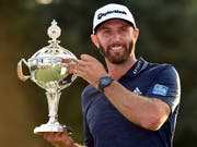 Die Enttäuschung am British Open ist vergessen: Dustin Johnson lächelt wieder (Bild: KEYSTONE/AP The Canadian Press/NATHAN DENETTE)
