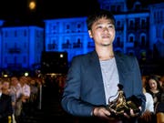 Sein Drama «A Land Imagined» überzeugte zwar nicht alle Zuschauer und Kritiker, dafür die Jury: Siew Hua Yeo aus Singapur erhielt am 71. Filmfestival in Locarno den Goldenen Leoparden. (Bild: KEYSTONE/ALEXANDRA WEY)