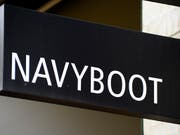 Gehört jetzt der Migros: Die Warenhausgruppe Globus übernimmt die Schuh- und Modenmarke Navyboot. (Bild: KEYSTONE/STEFFEN SCHMIDT)
