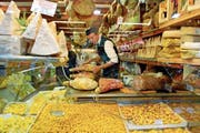   You want to buy: Pasta, Parmigiano, Prosciutto in a grocery store near Piazza Maggiore in Bologna. (Image: Dino Fracchia / Alamy) 