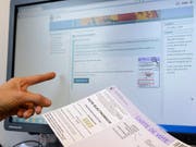Der Nationalrat will die weitere Entwicklung des E-Votings nicht blockieren. Er hat parlamentarische Vorstösse abgelehnt, die das forderten. (Bild: KEYSTONE/MARTIAL TREZZINI)