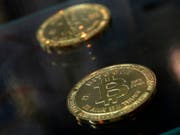 Das Unternehmen will eine Brücke zwischen den traditionellen und Krypto-Finanzmärkten schlagen. (Bild: KEYSTONE/AP/KIN CHEUNG)