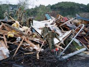 Nach dem verheerenden Erdbeben im Norden Japans am Donnerstag finden Rettungskräfte immer mehr Todesopfer. (Bild: KEYSTONE/AP Kyodo News/YUSUKE OGATA)