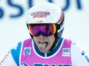Gino Caviezel reagiert gespalten, als er nach seinem zweiten Lauf die «2» aufleuchten sieht (Bild: KEYSTONE/PETER SCHNEIDER)