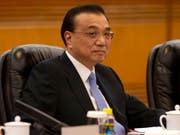 Der chinesische Ministerpräsident Li Keqiang zeigt sich für das Wirtschaftswachstum seines Landes optimistisch. (Bild: KEYSTONE/EPA AP POOL/NG HAN GUAN / POOL)