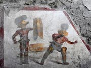 Das neu entdeckte Fresko in der Römerstadt Pompeji zeigt zwei Gladiatoren im Kampf - mit detaillierter Darstellung der Wunden. (Bild: Pompeii Archaeological Park)