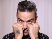 Der britische Sänger Robbie Williams veröffentlicht ein Weihnachtsalbum - mit Gästen wie Schlagersängerin Helene Fischer oder dem früheren Boxweltmeister Tyson Fury. (Bild: Keystone/EPA AAP/DAVID MOIR)
