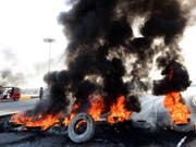 Die Wut der Bürger in den Strassen von Bagdad. (Bild: KEYSTONE/EPA/MURTAJA LATEEF)