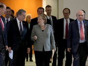 Die deutsche Kanzlerin Angela Merkel (Bildmitte) hat am Dienstag mit den Chefs von weltweiten Institutionen über die Entwicklung der globalen Wirtschaft diskutiert und weise Entscheide im Handelsstreit sowie beim Brexit gefordert. (Bild: KEYSTONE/AP/MICHAEL SOHN)