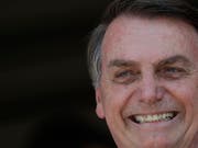 Brasiliens Präsident Jair Bolsonaro kann sich freuen: Mit der Verabschiedung der Rentenreform erfüllt der Politiker ein Wahlversprechen. (Bild: KEYSTONE/AP/ERALDO PERES)